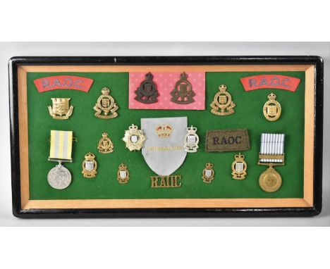 A Framed Collection of Royal Army Ordnance Corps Badges, Medals Etc 