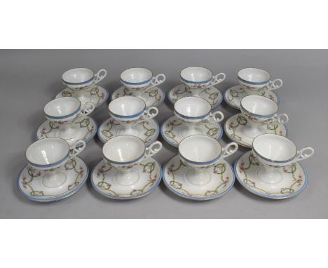 A Set of 12 Pedestal Cups and Saucers, All decorated with Garland, Swag and Bow Designs with Blue and Gilt Trim 