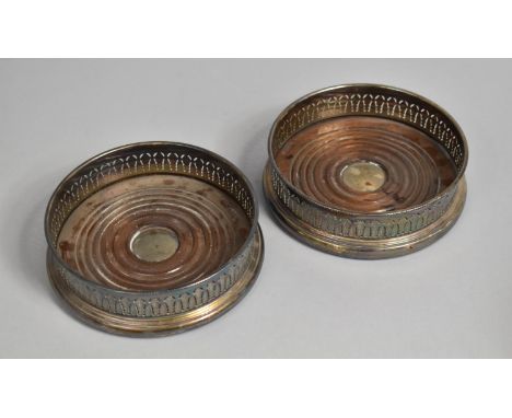 A Pair of Mid 20th Century Silver Plated Bottle Coasters with Pierced Decoration, 13cms Diameter 