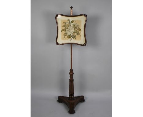 A Mid 19th Century Pole Screen with Tapestry Panel on Turned Support and Triform Base 