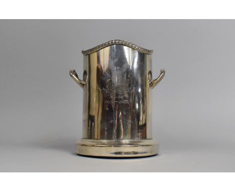 A Mid 20th Century Silver Plated Bottle Coaster with Two Handles, 17cms High 