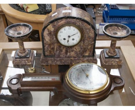 An Edwardian marble clock and a pair of garnitures; and an oak wheel barometer&nbsp;