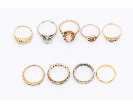 A collection of gold rings to include a 22ct gold wedding band, size L, weight approx. 2.5gms, two 18ct gold rings, one set w