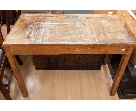 A 1950's pine double children's school desk with inkwell