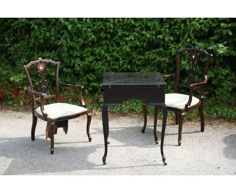 An early 20th Century ebonised fold-over card table, raised on cabriole legs, together with a pair of Edwardian open armchair