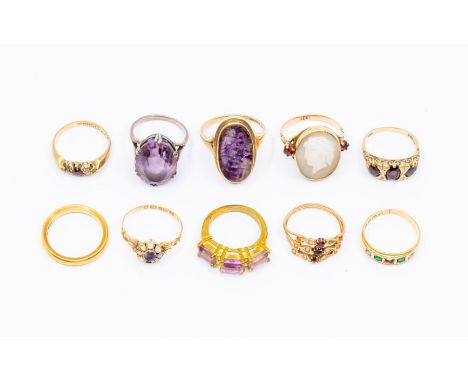 A collection of rings to include a ruby and diamond 18ct gold ring, an emerald and diamond 18ct gold ring, (both missing a di