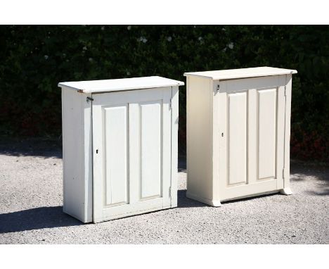 A pair of white painted wall cabinets, each having a single two-panel door, enclosing a single shelf (2)