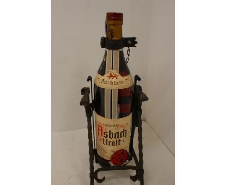 A Bottle Of Asbach Uralt  Brandy Complete With Wrought Iron Pouring Stand.  From The NAAFI Stores For HM Forces, And Often Fo