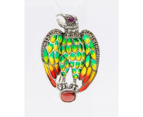 A silver and plique a jour enamel brooch/pendant  in the form of an eagle clasping an oval ruby, marcasite set eyes,  length 