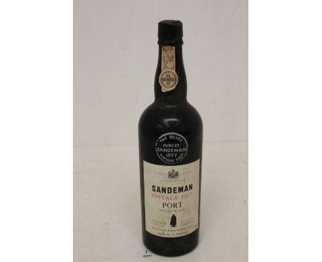 A Bottle Of Sandeman Vintage 1977 Port Bottled In 1979 The Silver Jubilee Sandeman Vintage 1977 Port Bottle Is In Good Overal