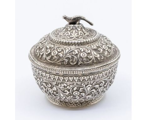 An Asian silver circular bowl and cover, profusely chased and engraved decoration, the cover with bird finial, 6.19 ozt&nbsp;