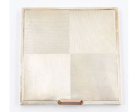 A modern silver compact, square form with machine engraved quarters, rose gold tone tensioned&nbsp;button clasp, size approx.
