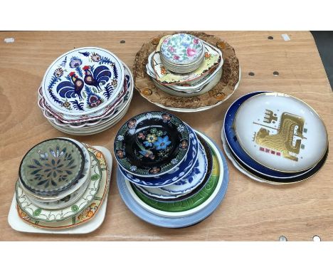 A large collection of ceramic plates and saucers, consisting of a variety of designs and makers, all A/F (qty)