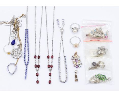 A collection of silver jewellery comprising silver and gem set jewellery, to include a tanzanite set necklace along with simi