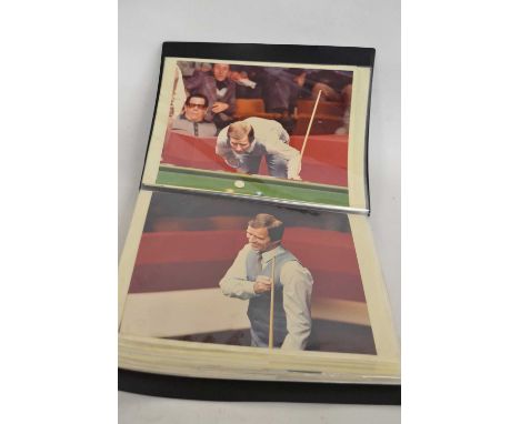 A folder comprising  black and white photographs of the career and life of the snooker player John Spencer