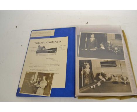A folder containing black and white photographs of the Ladies Billiards Championship and Snooker Championship including a pho