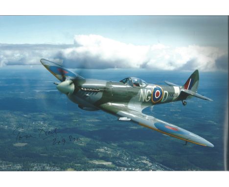 WW2 Battle of Britain fighter ace Tom Neil signed 12 x 8 inch colour photo of a Spitfire in flight. Good condition. All autog