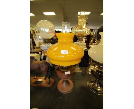 Oil lamp with dipped bronzed body and big yellow shade