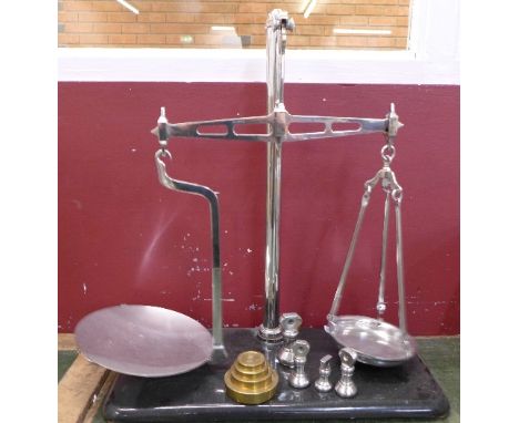 A set of chrome balance scales and weights