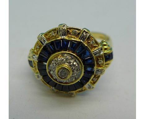 An 18ct gold, sapphire and diamond cluster ring, 5.4g, R