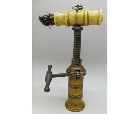 An 18th/19th Century brass corkscrew with dusting brush