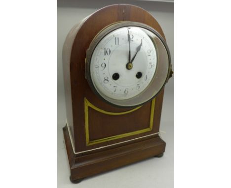 An arch top mantel clock with striking movement, with two keys and pendulum, dial and case a/f, 27cm