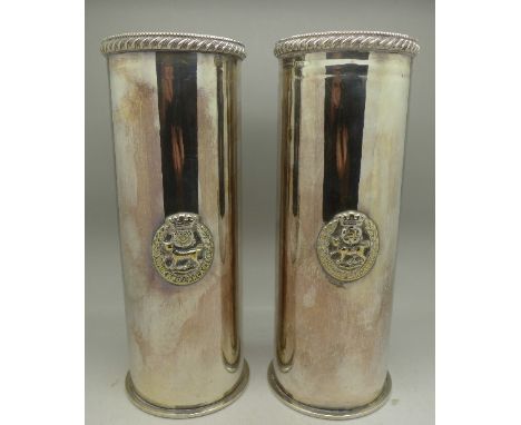 A pair of plated trench art WWI shell cases, each with York and Lancaster regimental motif, 23cm