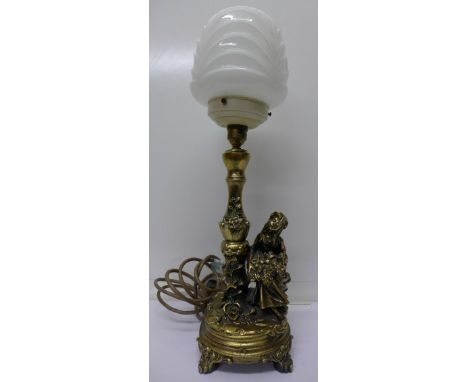 A gilt table lamp with Art Deco style shade