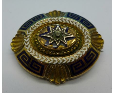 A yellow metal and enamel brooch, 42mm