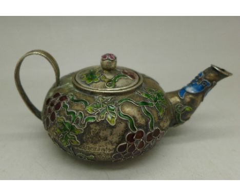 A miniature enamel teapot