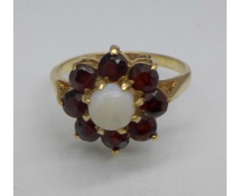 A 9ct gold, opal and garnet flower shaped ring, 2.6g, K