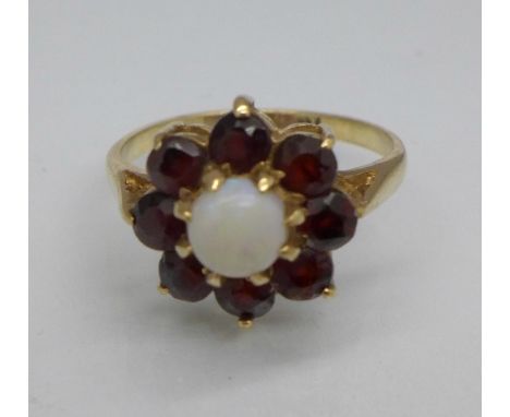 A 9ct gold, opal and garnet flower shaped ring, 2.6g, K