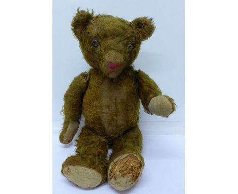 A straw filled brown plush Teddy bear with growler, a/f, 47cm