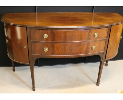 SIDEBOARD - a 1930s bow front sideboard featuring two drawers and two side cabinets. Includes keys for the side cabinets. Mea