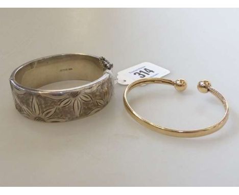 9ct gold bangle, 7.5 grams; and a silver bangle (2)