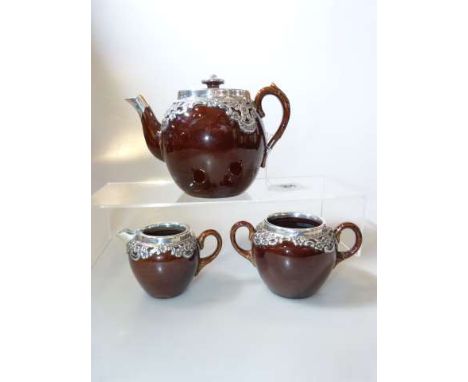 Edwardian silver-mounted pottery three-piece tea service, Henry Bourne, Birmingham 1901 and 1902