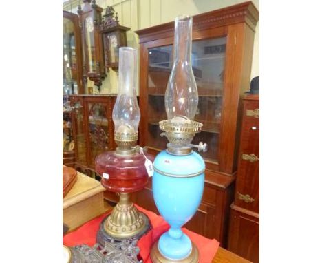 Victorian opaque blue glass oil lamp and ruby reservoir oil lamp (2)