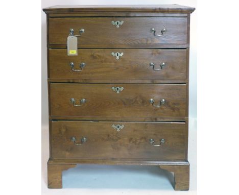 An early 19th century elm chest of four drawers raised on bracket feet, H.115 W.92 D.50cm 