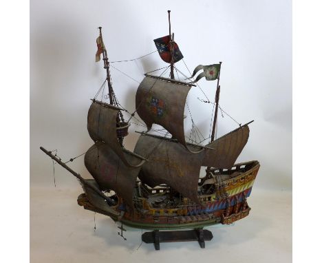 An early 20th century painted wooden model of a galleon, H.69 W.65cm 