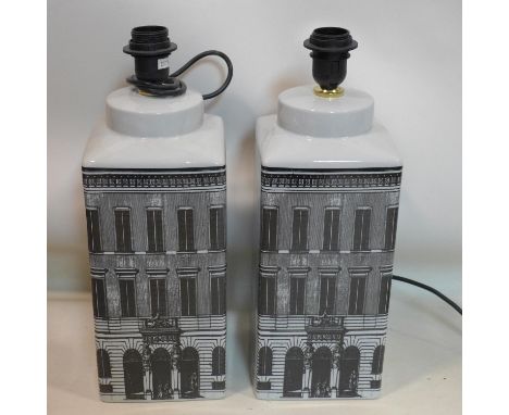 A pair of contemporary Fornasetti style architectural lamp bases, in the form of houses, (no shades), H.46cm (2) 