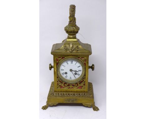 A late 19th/early 20th century French brass mantle clock, with lion finial and paw feet, H.41 W.23 D.13cm 