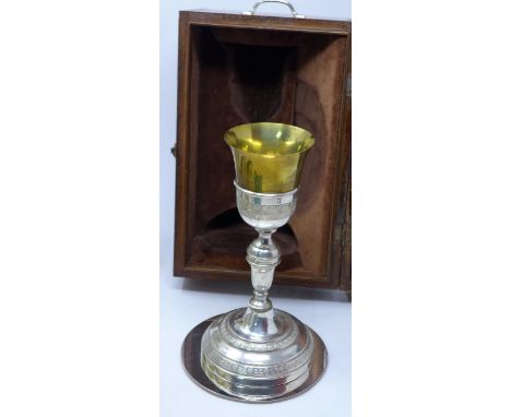 An early 20th century silver plated and gilt metal communion goblet and tray in fitted mahogany box 