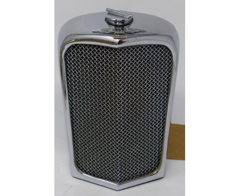 A 1950/60's chrome flask in the form of a Jaguar radiator, H.18 W.11 D.7cm 