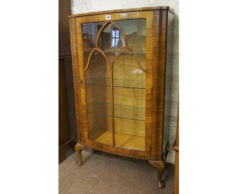 A Vintage Walnut China Cabinet, with a glazed door enclosing glass shelves, raised on cabriole feet, 115cm high, 66cm wide, 3