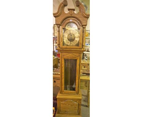 A Reproduction Oak Cased Longcase Clock, With a 10 inch Georgian style celestial dial with a chime/silent lever, above a glaz