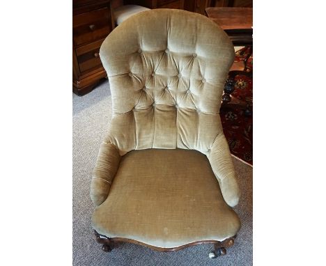 A Victorian Walnut Gossip Chair, Upholstered in button back velour, with serpentine shaped seat, raised on shaped legs with c