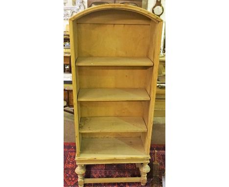 A Light Oak Open Bookcase, With a canopy style top, 130cm high, 59cm wide, 29cm deep