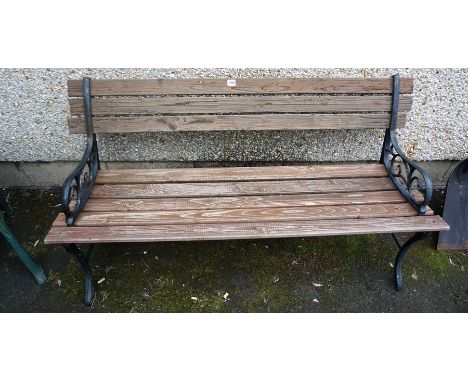 A Garden Bench, with painted metal ends and wooden slats to back rest and seat, 70cm high, 138cm wide