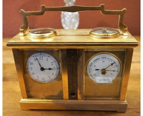 A Gilt Metal Cased Carriage Clock/Barometer, With a compass dial to the top, above a thermometer, flanked with enamel clock a