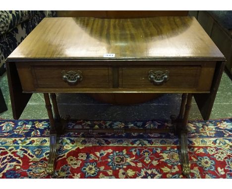 A Mahogany Sofa Style Telephone Table, Raised on scroll supports with castors, 52cm high, 106cm wide, 40cm deep